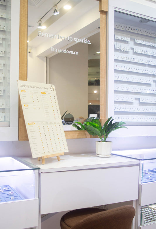 Ear piercing studio counter and sterile jewellery display at Adove Jewellery in Kuching