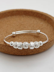 S990 Rolling Beads Baby Bangle